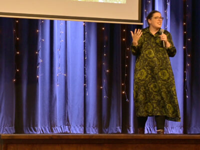 Image of a speaker on a stage