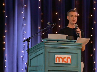 Image of a speaker on a stage