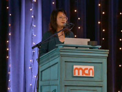 Image of a speaker on a stage