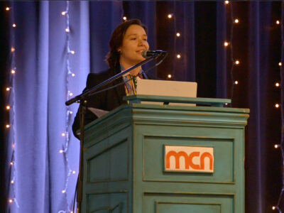 Image of a speaker on a stage