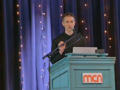 Image of a speaker on a stage