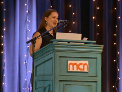 Image of a speaker on a stage